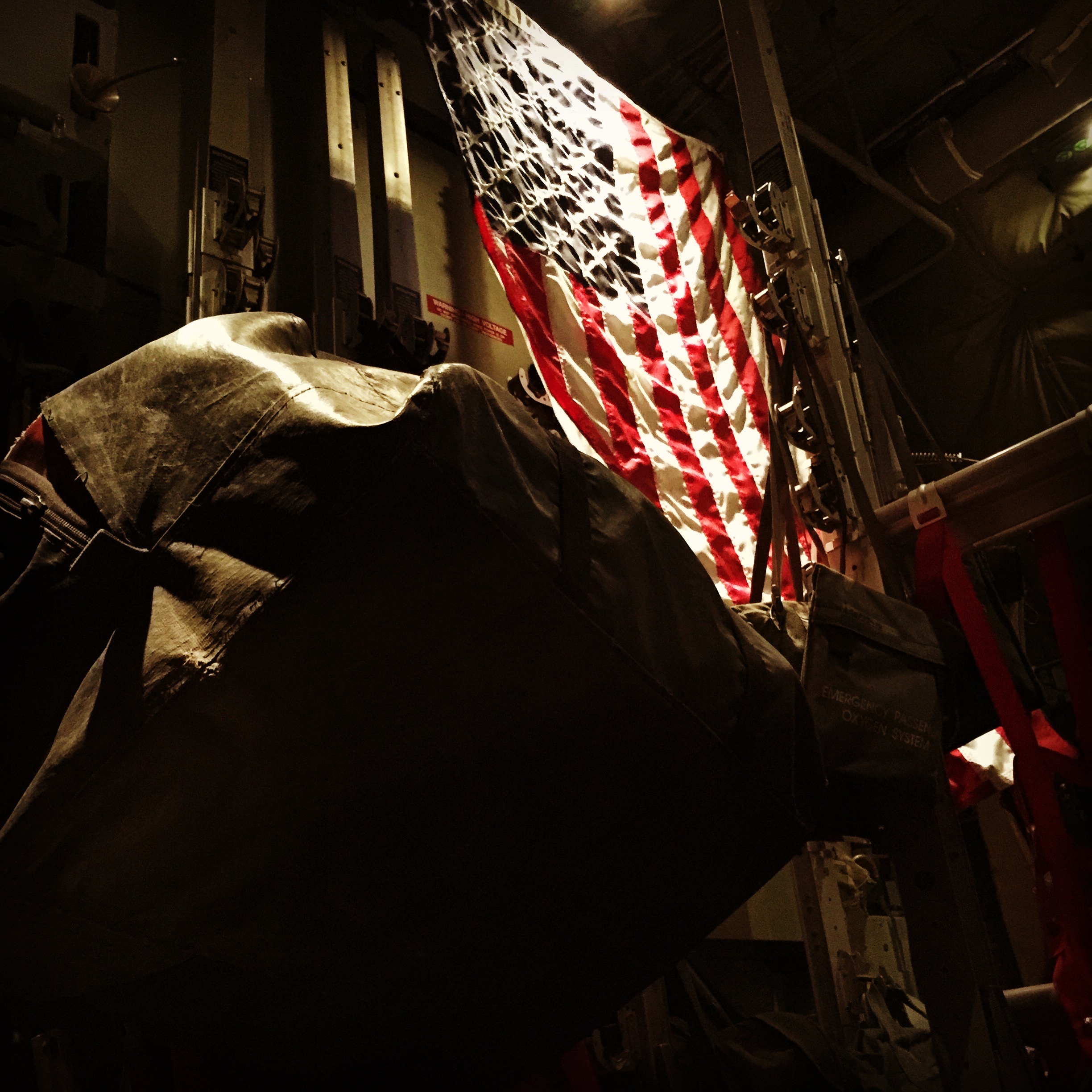 American flag illuminated in military setting